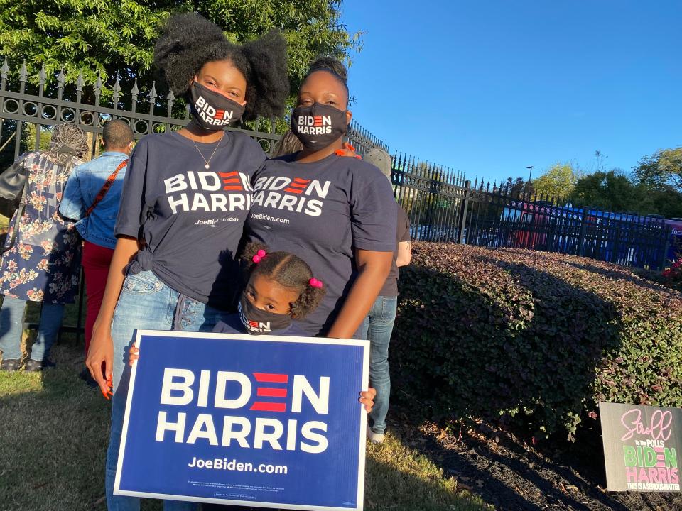 Yvonne Young and her two daughters outside of a Kamala Harris rally in Atlanta, Georgia.  (Richard Hall / The Independent )