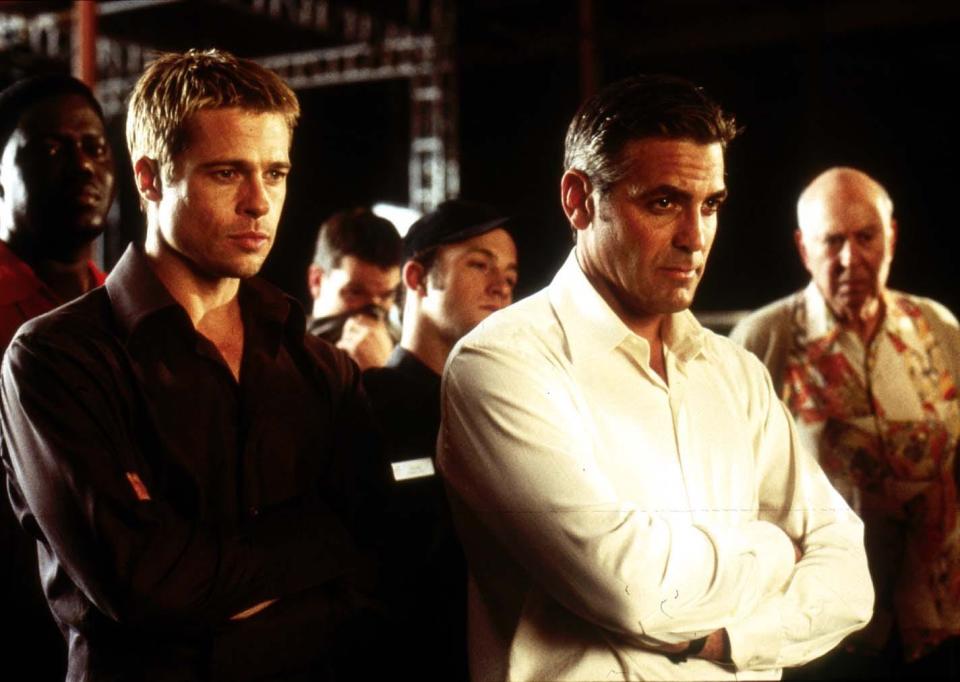 Brad Pitt, left, as Rusty Ryan and George Clooney as Danny Ocean star in "Ocean's Eleven."