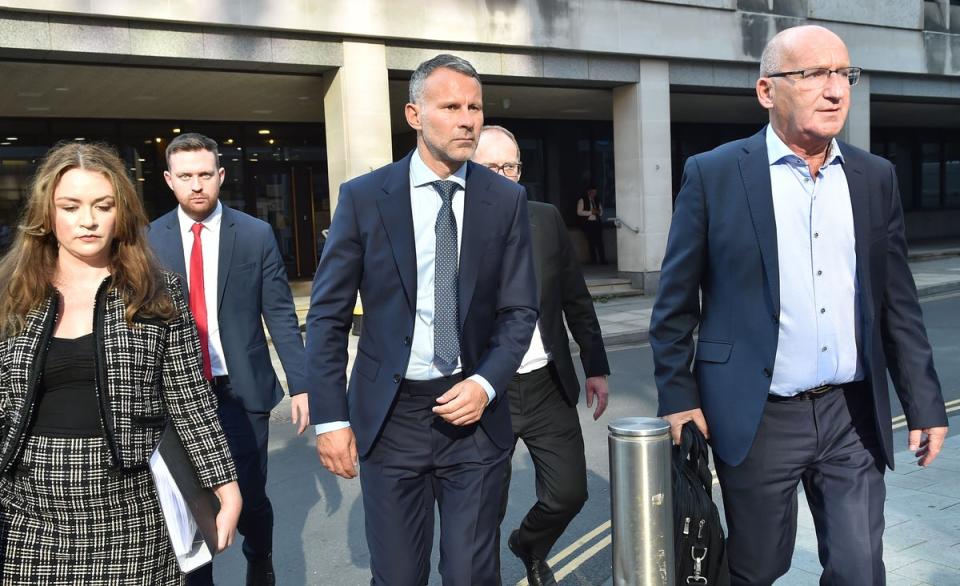 Former Manchester United footballer Ryan Giggs (centre) leaves court (Steven Allen/PA) (PA Wire)