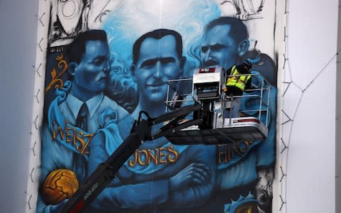 Artist Solomon Souza paints the Holocaust Commemorative Mural  - Credit: Getty Images