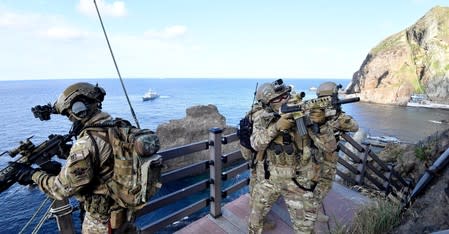 Members of South Korean Naval Special Warfare Group take part in a military exercise in remote islands called Dokdo