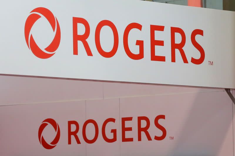 FILE PHOTO: FILE PHOTO: Rogers Communications logos are seen above a booth at the Canadian International AutoShow in Toronto