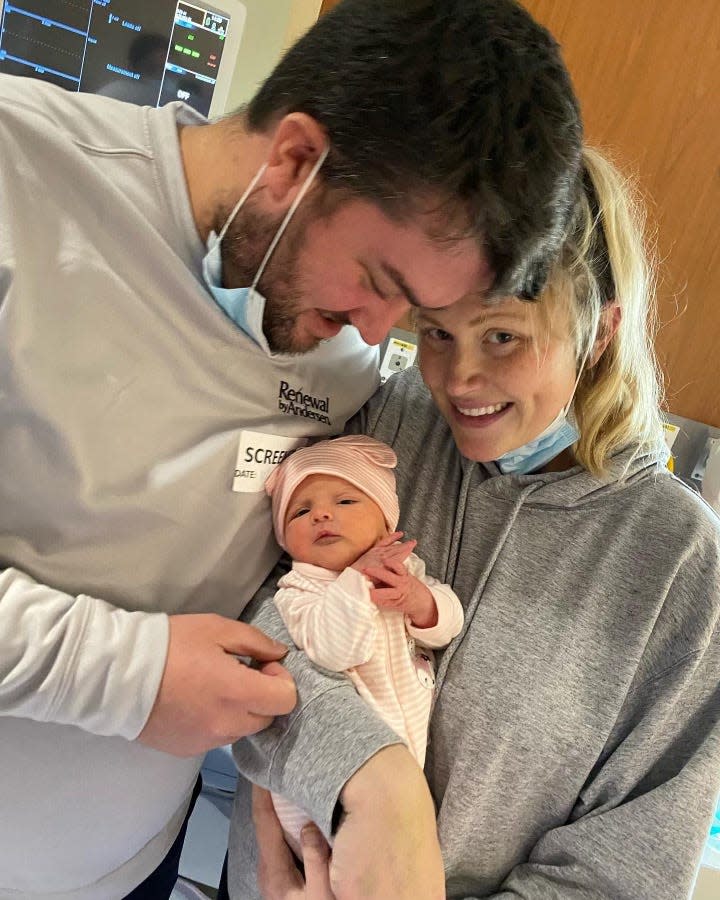 Nicholas and Sydney Jowett with their newborn, Isabelle Jowett. Isabelle was born by cesarean section after Sydney contracted COVID-19.