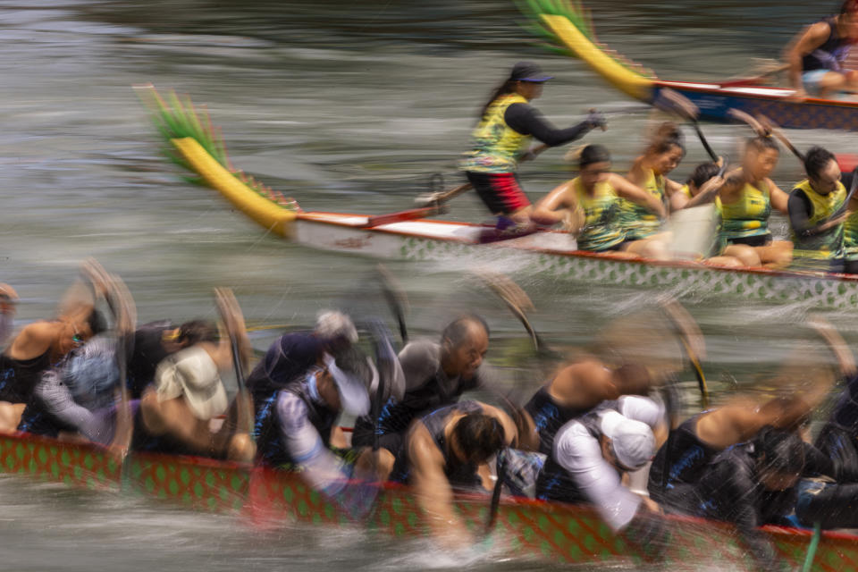 Competitors take part in the annual dragon boat race to celebrate the Tuen Ng festival in Hong Kong, Thursday, June 22, 2023. (AP Photo/Louise Delmotte)