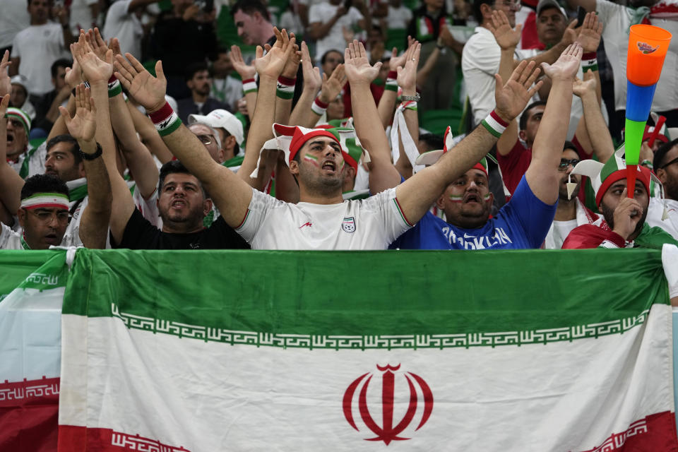 Fans of Iran cheer prior the the World Cup group B soccer match between Iran and the United States at the Al Thumama Stadium in Doha, Qatar, Tuesday, Nov. 29, 2022. (AP Photo/Manu Fernandez)