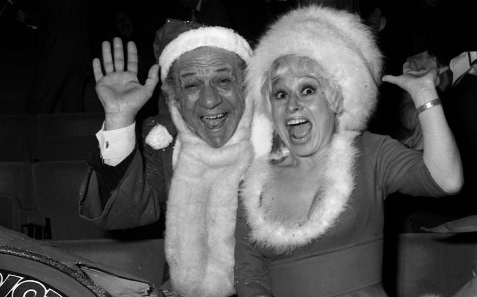 With Sid James, her Carry On co-star, at ITV's Christmas party in 1973 - PA