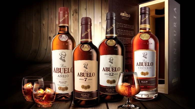 Abuelo Rum bottles by wood