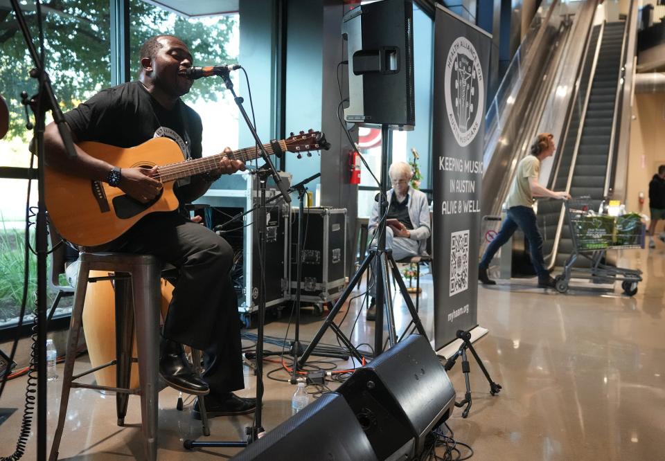Roland Kemokai, of Roland & the Roots Riddim, performs at the Lake Austin H-E-B for HAAM Day. A car he received thanks to Season for Caring has allowed Kemokai and his wife, Christine, to both pick up more gigs.