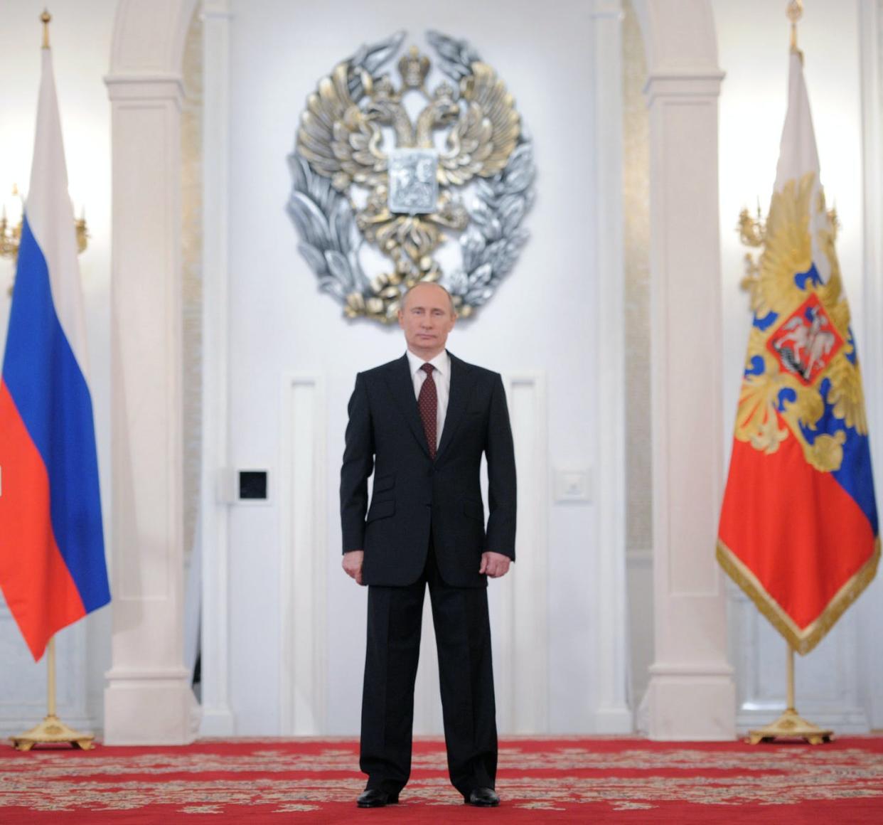 <span class="caption">Russian President <span class="caas-xray-inline-tooltip"><span class="caas-xray-inline caas-xray-entity caas-xray-pill rapid-nonanchor-lt" data-entity-id="Vladimir_Putin" data-ylk="cid:Vladimir_Putin;pos:1;elmt:wiki;sec:pill-inline-entity;elm:pill-inline-text;itc:1;cat:OfficeHolder;" tabindex="0" aria-haspopup="dialog"><a href="https://search.yahoo.com/search?p=Vladimir%20Putin" data-i13n="cid:Vladimir_Putin;pos:1;elmt:wiki;sec:pill-inline-entity;elm:pill-inline-text;itc:1;cat:OfficeHolder;" tabindex="-1" data-ylk="slk:Vladimir Putin;cid:Vladimir_Putin;pos:1;elmt:wiki;sec:pill-inline-entity;elm:pill-inline-text;itc:1;cat:OfficeHolder;" class="link ">Vladimir Putin</a></span></span> stands alone.</span> <span class="attribution"><a class="link " href="https://www.gettyimages.com/detail/news-photo/russias-president-vladimir-putin-stands-at-georgiyevsky-news-photo/146204667" rel="nofollow noopener" target="_blank" data-ylk="slk:Alexey Druzhinin/AFP via Getty Images;elm:context_link;itc:0;sec:content-canvas">Alexey Druzhinin/AFP via Getty Images</a></span>