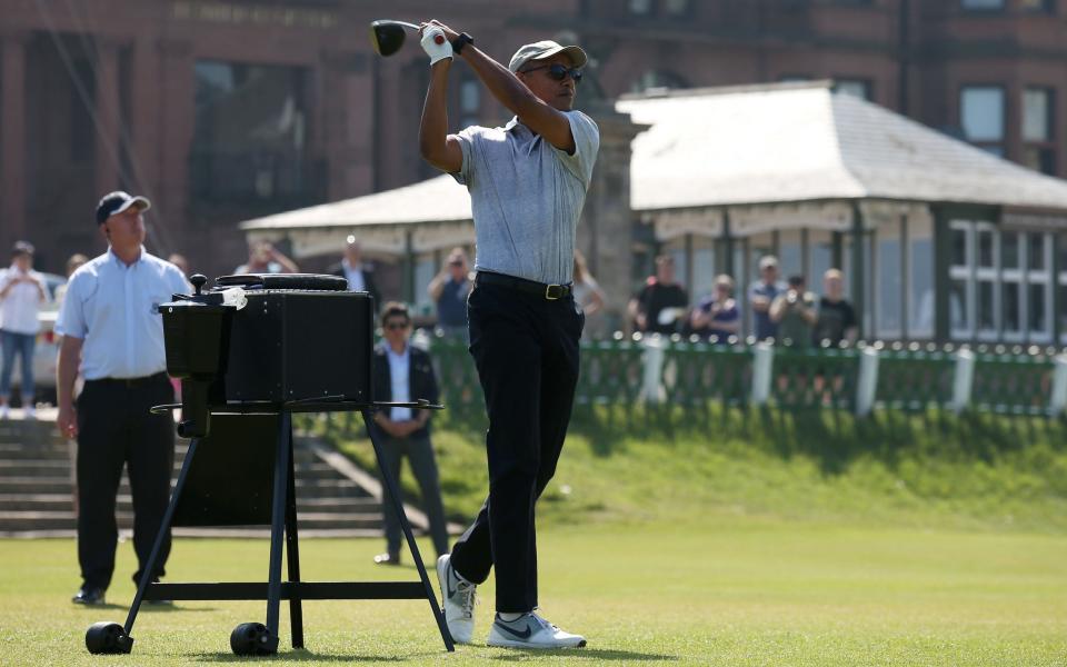 Former US president Barack Obama tees off at the first hole at St Andrews - Credit: Andrew Milligan/PA