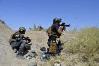 <p>Iraqi counterterrorism forces face off with Islamic State militants on the southern edge of Fallujah, Iraq, on Tuesday, May 31, 2016, a day after launching an operation of the militant-held city with the help of U.S.-led coalition airstrikes. (AP Photo/Osama Sami) </p>