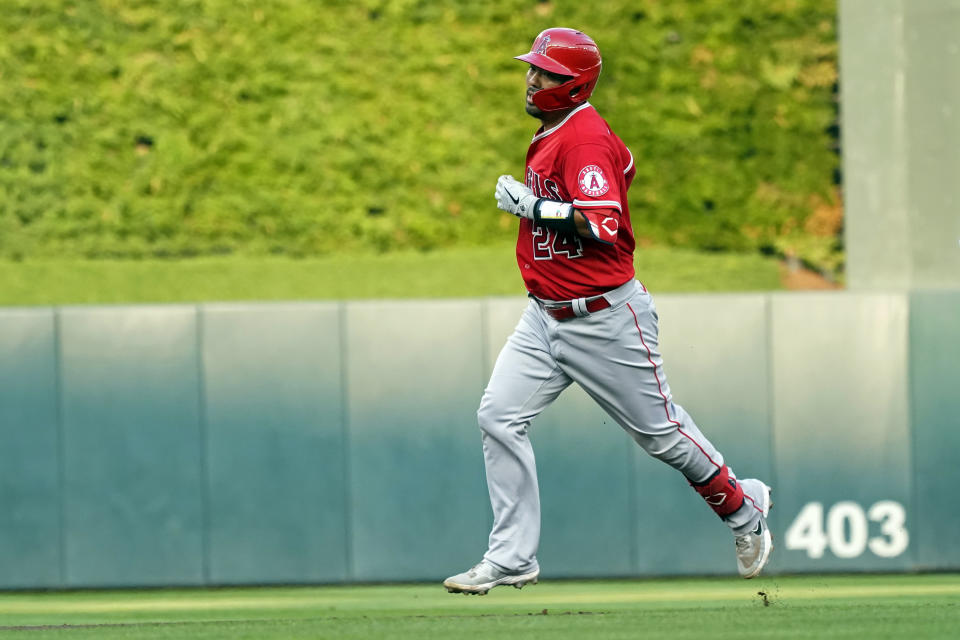 Los Angeles Angels' Kurt Suzuki runs the bases on a two-run home run off Minnesota Twins pitcher J.A. Happ during the first inning of a baseball game Friday, July 23, 2021, in Minneapolis. (AP Photo/Jim Mone)