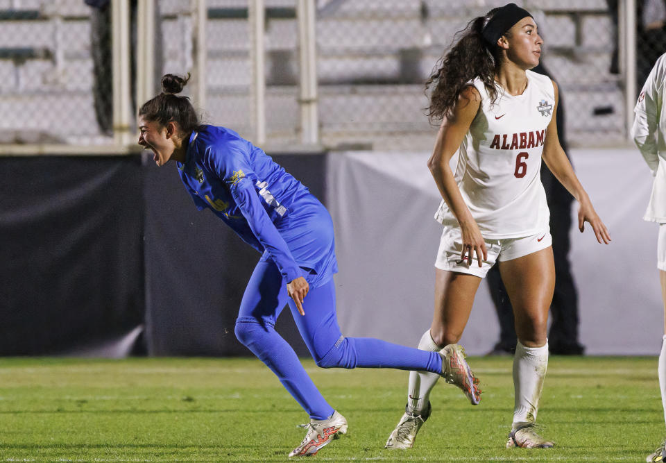 Madelyn Desiano (11) celebrates next to Alabama's Sasha Pickard (7) after scoring a goal during the second half of an NCAA women's soccer tournament semifinal in Cary, N.C., Friday, Dec. 2, 2022. (AP Photo/Ben McKeown)