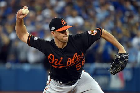 Baltimore Orioles relief pitcher Darren O'Day (56) pitches during the tenth inning against the Toronto Blue Jays in the American League wild card playoff baseball game at Rogers Centre. Mandatory Credit: Dan Hamilton-USA TODAY Sports