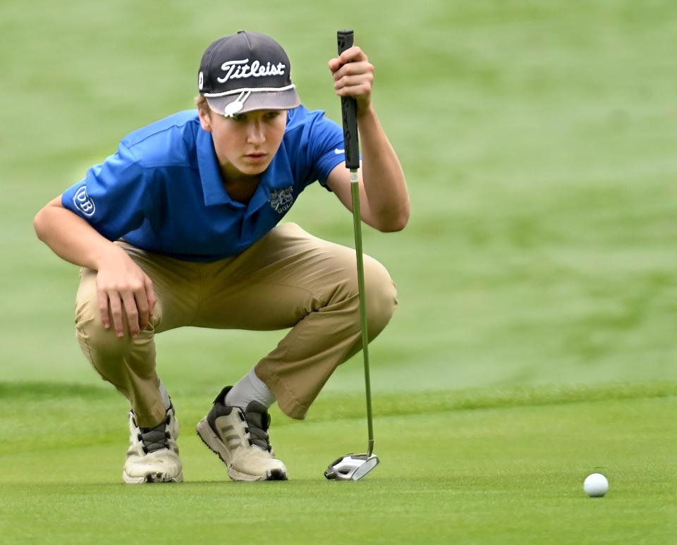 Dover-Sherborn's Sean Scannell sizes up a putt during the MIAA Div. 3 golf championship match at Ledges Golf Club in South Hadley, Oct. 24, 2022.