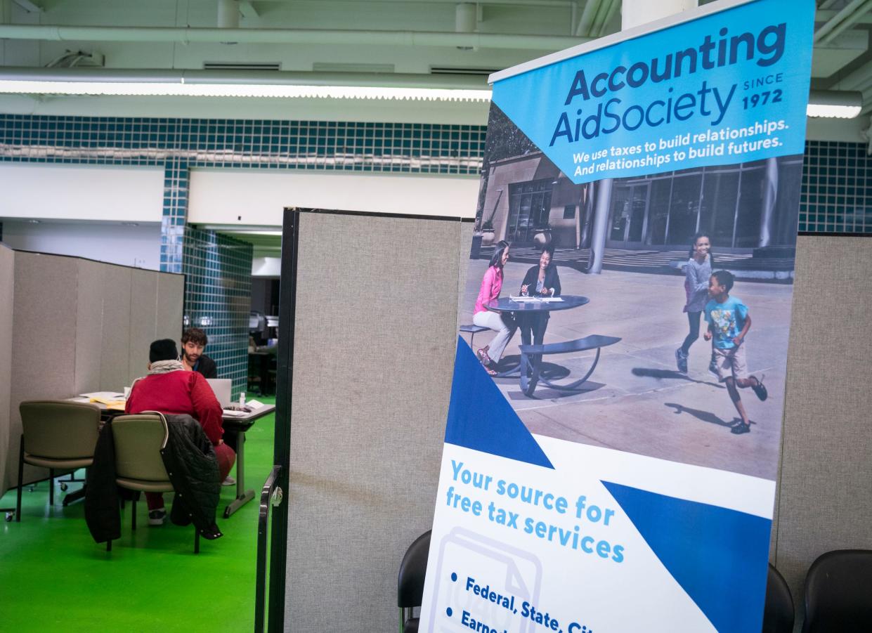 Elizabeth Walker, 64, of Detroit, left, gets help with her taxes from Rami Fradi, the site coordinator for the Accounting Aid Society at Focus: HOPE in Detroit on Wednesday, Jan. 31, 2024. Walker said she has has used the service for six or seven years because it is offered for free.