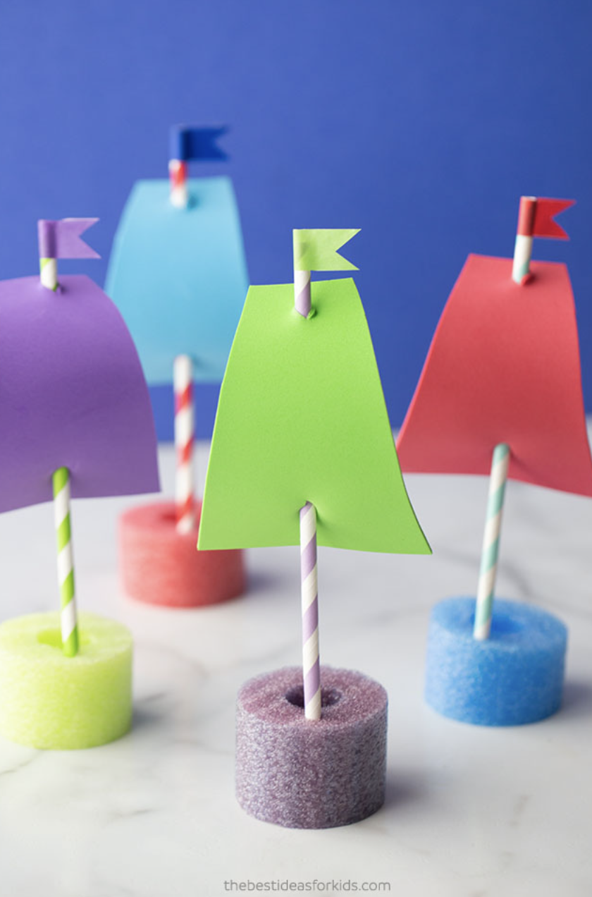 crafts for kids, tiny boats made with pool noodles and paper straws, with flags on top