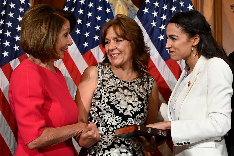House Speaker Nancy Pelosi talks with Rep. Alexandria Ocasio-Cortez, D-N.Y., right, and her mother Blanca Ocasio-Cortez, center, during a ceremonial swearing-in on Capitol Hill in Washington, Thursday, Jan. 3, 2019, during the opening session of the 116th Congress.