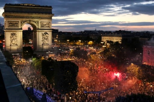 Fans in Paris celebrate France's victory against Belgium in the World Cup semi-finals