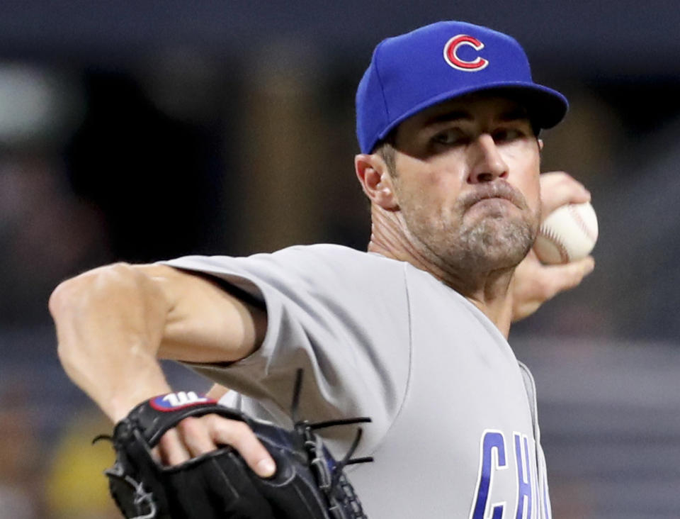 FILE- In this Aug. 17, 2018, file photo, Chicago Cubs starter Cole Hamels pitches to a Pittsburgh Pirates batter during the first inning of a baseball game in Pittsburgh. The Cubs face a decision on Hamels' option on Friday, Nov. 2,2018, as baseball teams decide whether to make $17.9 million qualifying offers to their eligible former players (AP Photo/Keith Srakocic, File)