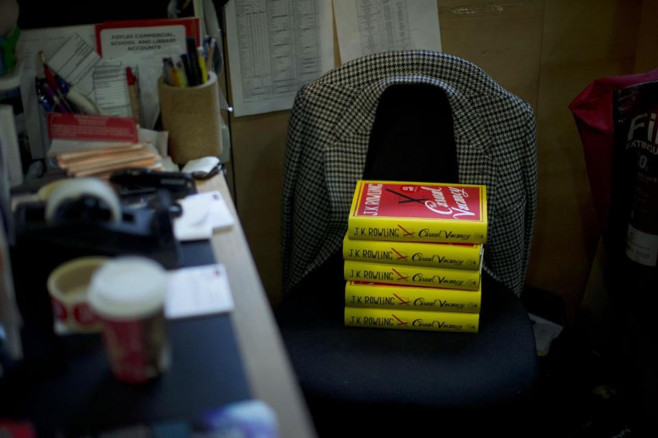 Copies of the "The Casual Vacancy" by author J.K. Rowling rest on a chair behind the sales counter to go on the shelves at a book store in London, Thursday, Sept. 27, 2012. British bookshops are opening their doors early as Harry Potter author J.K. Rowling launches her long anticipated first book for adults. Publishers have tried to keep details of the book under wraps ahead of its launch Thursday, but "The Casual Vacancy" has gotten early buzz about references to sex and drugs that might be a tad mature for the youngest "Potter" fans. (AP Photo/Matt Dunham)