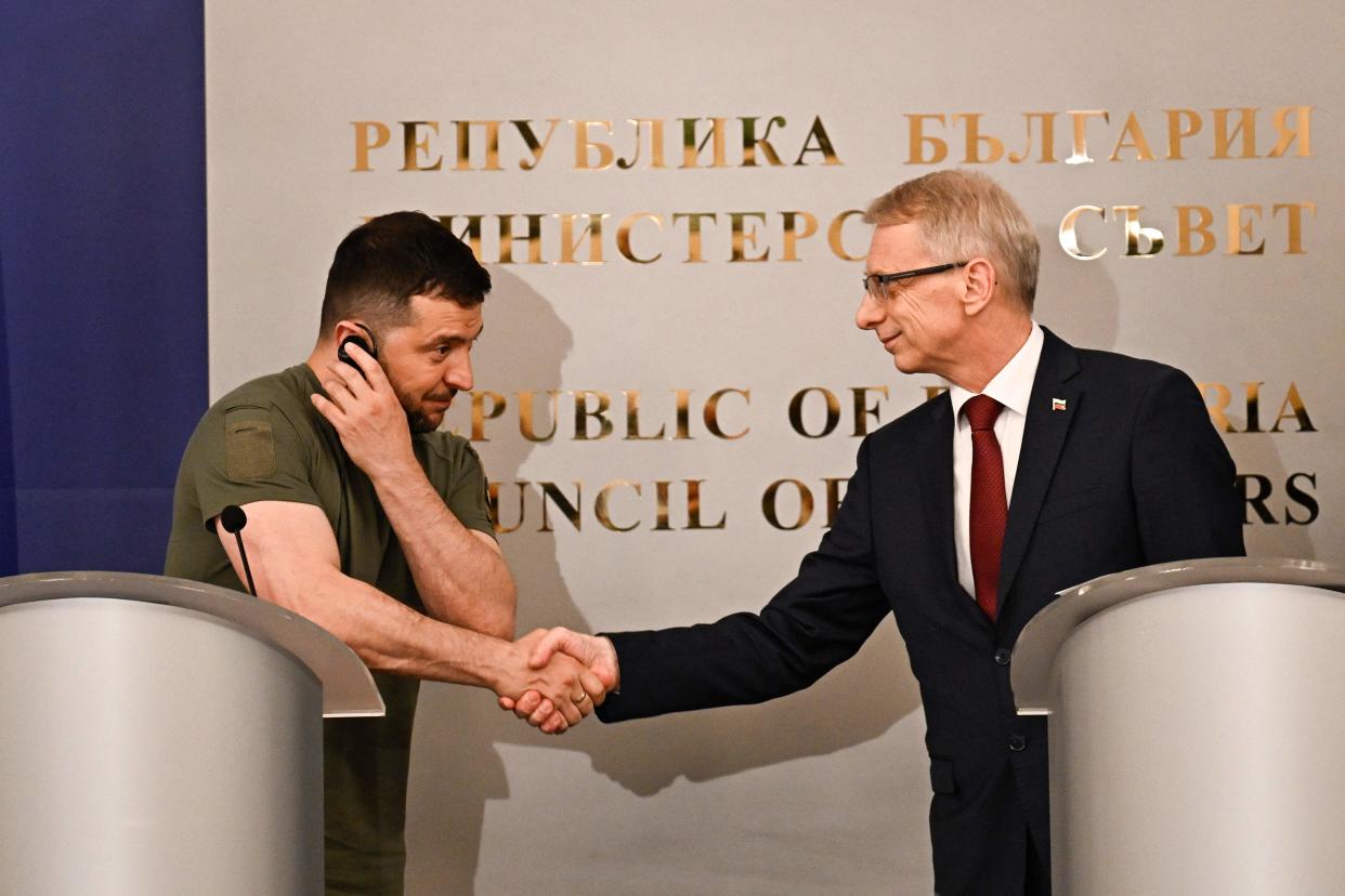 Zelensky and Denkov shake hands after addressing a joint news conference in Sofia (AFP via Getty Images)