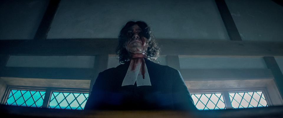 Cyrus Miller (Michael Chandler), aka The Pastor, is an all-seeing 17th-century church figure central to one of the most disturbing scenes in "Fear Street Part 3: 1666."