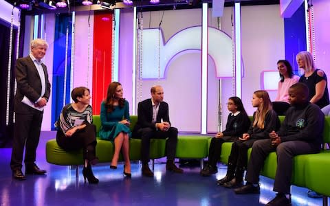 The Duke and Duchess of Cambridge, BBC director-general Tony Hall, and Director of BBC Children's Alice Webb talk about Own It - Credit: AFP
