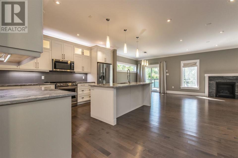 <p><span>5826 Fays Lane, Halifax, N.S.</span><br> The kitchen has quartzite stone countertops and a walk-in pantry.<br> (Photo: Zoocasa) </p>