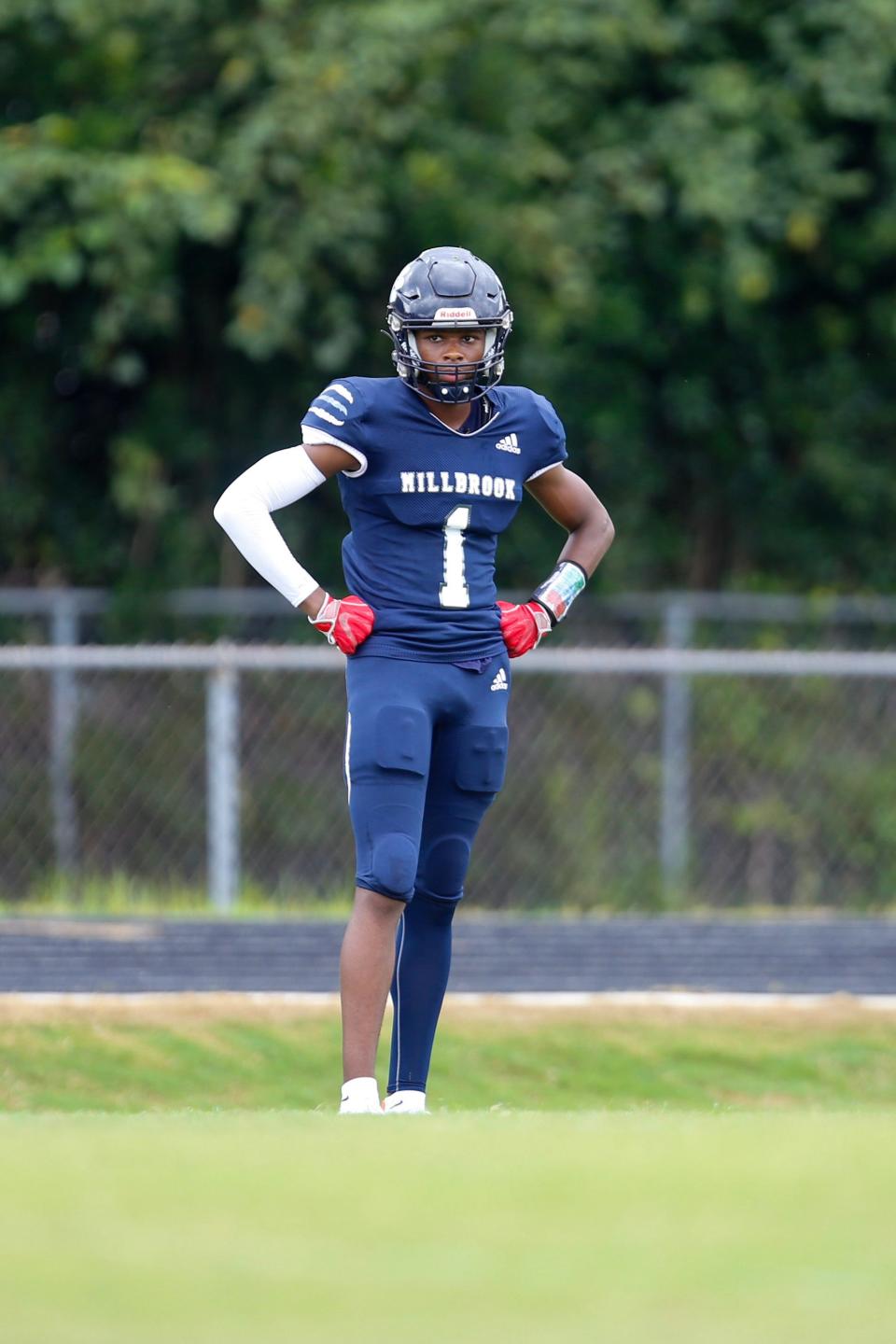 Millbrook football wide receiver and three-star 2022 recruit Wesley Grimes (1) competes against Enloe in an Aug. 27, 2021, game in Raleigh. The Wildcats won, 42-0.