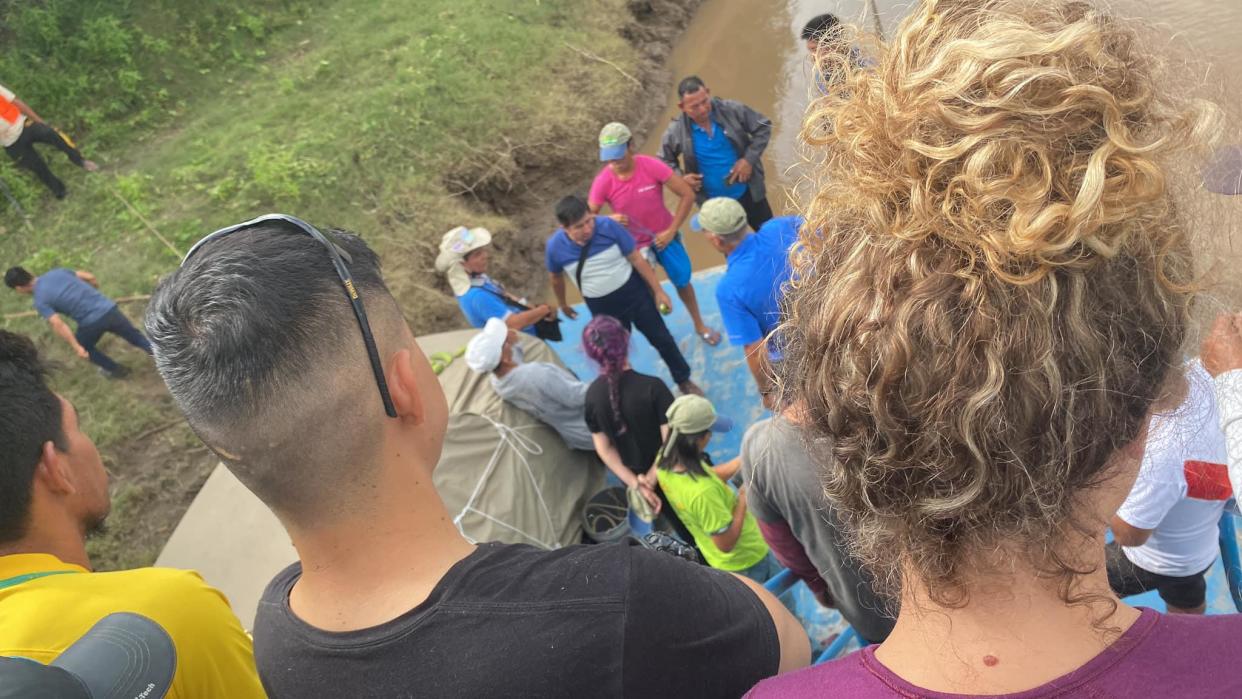 A photo posted online by Angela Ramirez on November 3, 2022, shows a group of tourists, including Ramirez, being held on a boat in Peru's Amazon region by an Indigenous group protesting what they say is the government's failure to help after an oil spill. / Credit: Angela Ramirez/Facebook