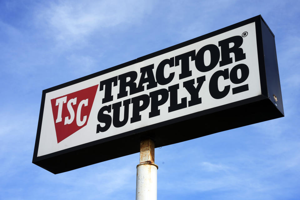 FILE - A Tractor Supply Company store sign is seen, Feb. 2, 2023, in Pittsburgh. Just weeks after Tractor Supply, a major rural retailer, ended an array of its corporate diversity and climate efforts, John Deere says it will no longer sponsor 