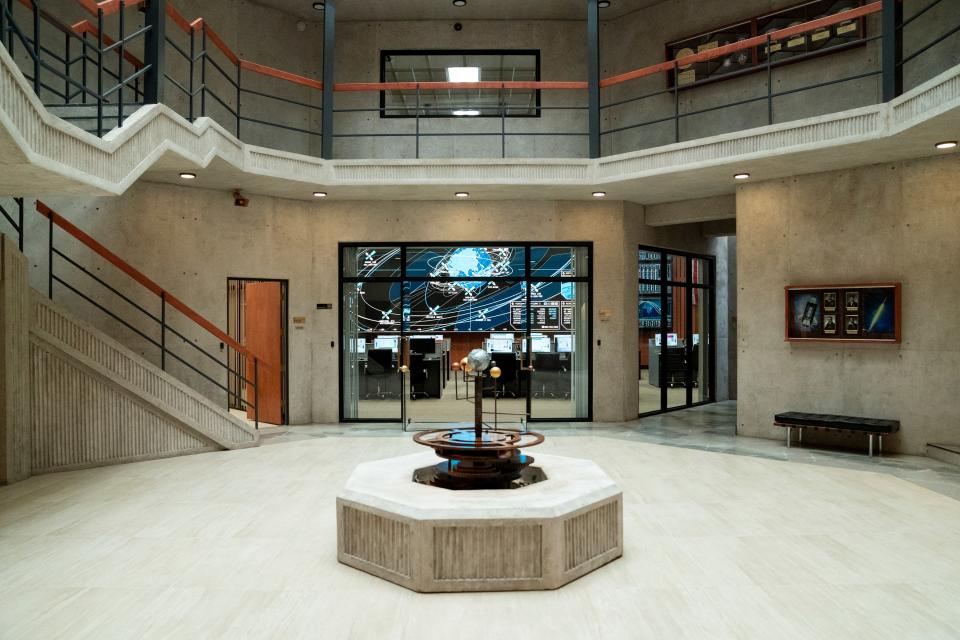 In keeping with the satirical designs, production designer Susie Mancini placed a model of the solar system from the Middle Ages, with the earth at the center, in the atrium of the Space Force headquarters.