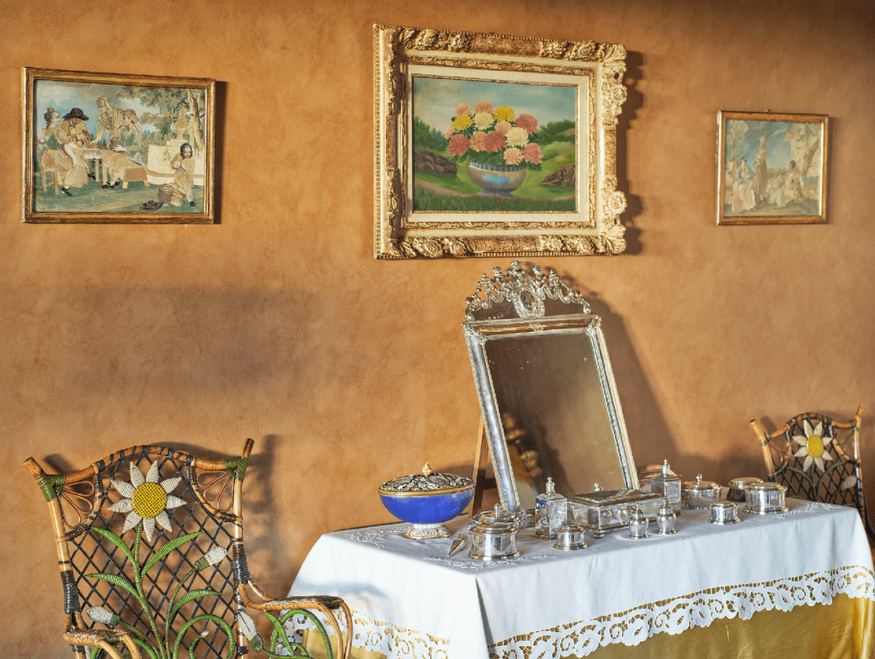 a table with a mirror and a bowl on it