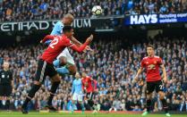 <p>Vincent Kompany rises to head Manchester City in front at The Etihad </p>