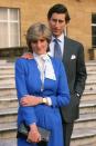 <p>At an official photocall to announce his engagement to Diana Spencer at Buckingham Palace. </p>