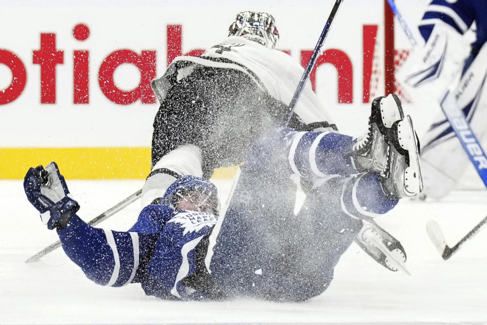 Toronto Maple Leafs' Mitchell Marner is left on the ice after a hit by a Los Angeles Kings player during the second period of an NHL hockey game, Tuesday, Oct. 31, 2023 in Toronto. (Chris Young/The Canadian Press)