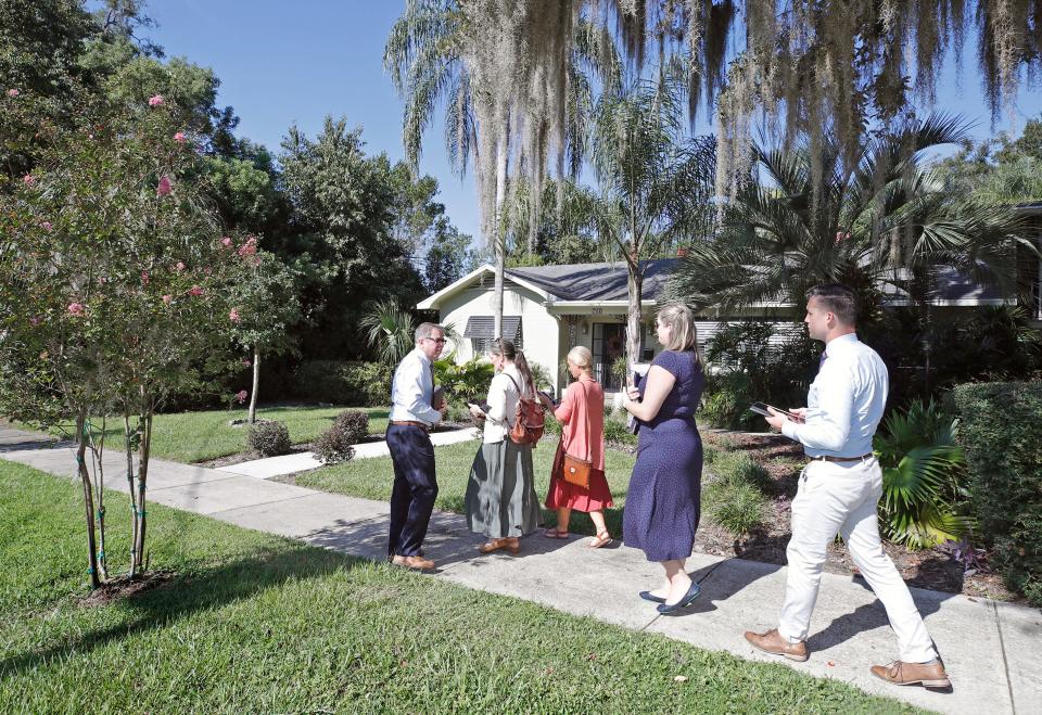 Jehovah's Witnesses return to their door-to-door ministry in a DeLand neighborhood this past week after a 2-1/2-year hiatus due to the pandemic.