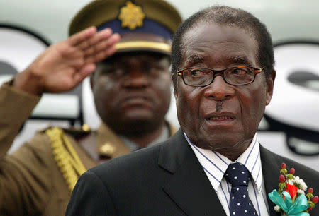 FILE PHOTO - Zimbabwe President Robert Mugabe attends the launch of basic commodities in Harare, Zimbabwe July 16, 2008. REUTERS/Philimon Bulawayo/File Photo