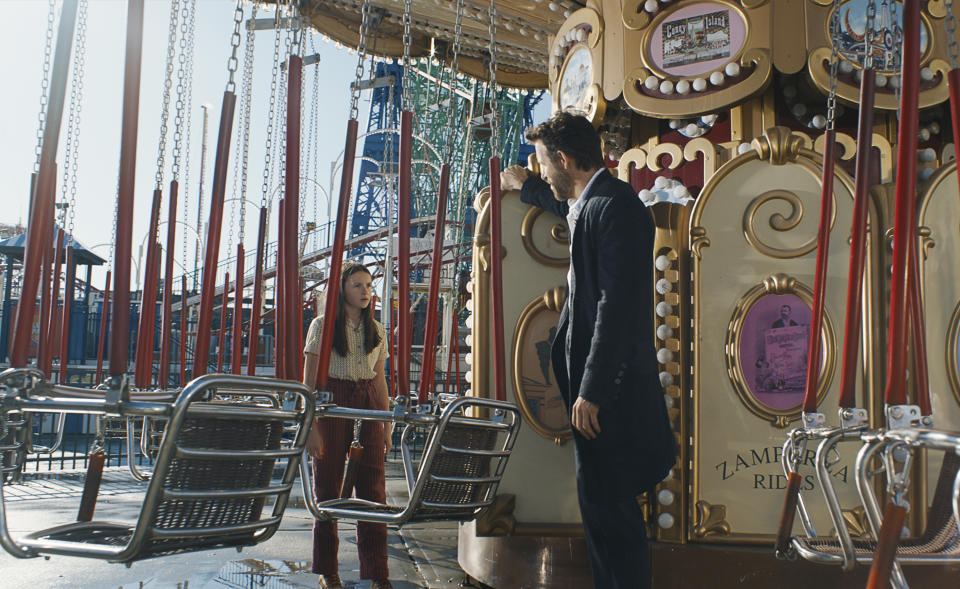 This image released by Paramount Pictures shows Cailey Fleming, left, and Ryan Reynolds in a scene from "IF." (Jonny Cournoyer/Paramount Pictures via AP)