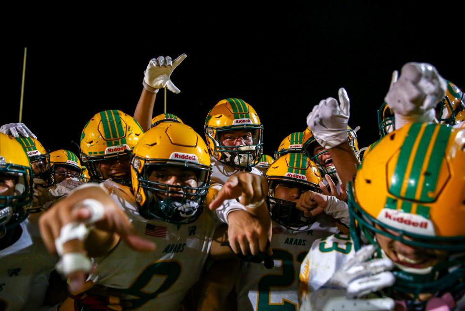 Coachella Valley players celebrate their win at Palo Verde High School in Blythe, Calif., Friday, Aug. 25, 2023.