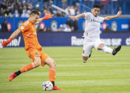 CF Montreal's goalkeeper Sebastian Breza clears the ball as Real Salt Lake's Pablo Ruiz moves in during the second half of an MLS soccer game in Montreal, Sunday, May 22, 2022. (Graham Hughes/The Canadian Press via AP)