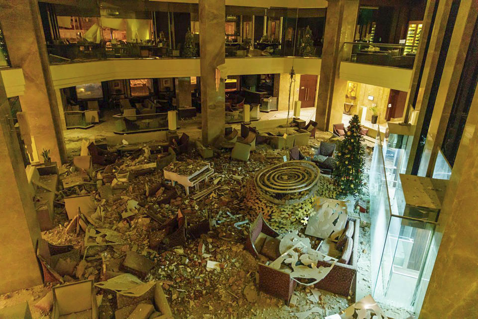 In this photo provided by Kharkiv Regional Administration, the ruined lobby of Kharkiv Palace Hotel is seen after Russia's missile attack in Kharkiv, Ukraine, Sunday, Dec. 31, 2023. (Kharkiv Regional Administration via AP)