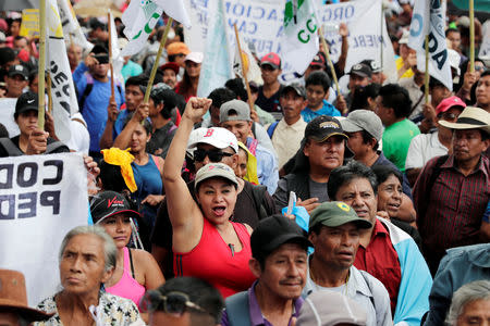 People take part in a march to demand the resignation of Guatemala's President Jimmy Morales in Guatemala City, Guatemala September 12, 2018. REUTERS/Luis Echeverria