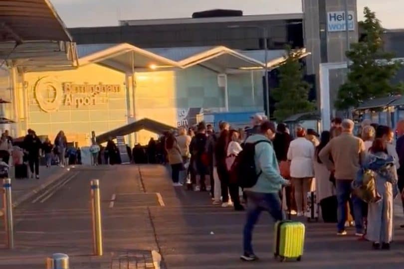 Passengers at Birmingham Airport have had to endure long queues that stretched outside the terminal