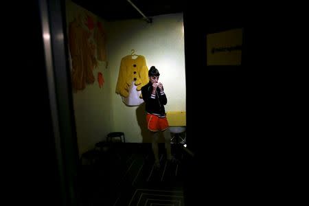 An actress relaxes before performing at Microteatro Por Dinero (Microtheatre for money) in central Madrid, Spain September 2, 2016. Picture taken September 2, 2016. REUTERS/Andrea Comas