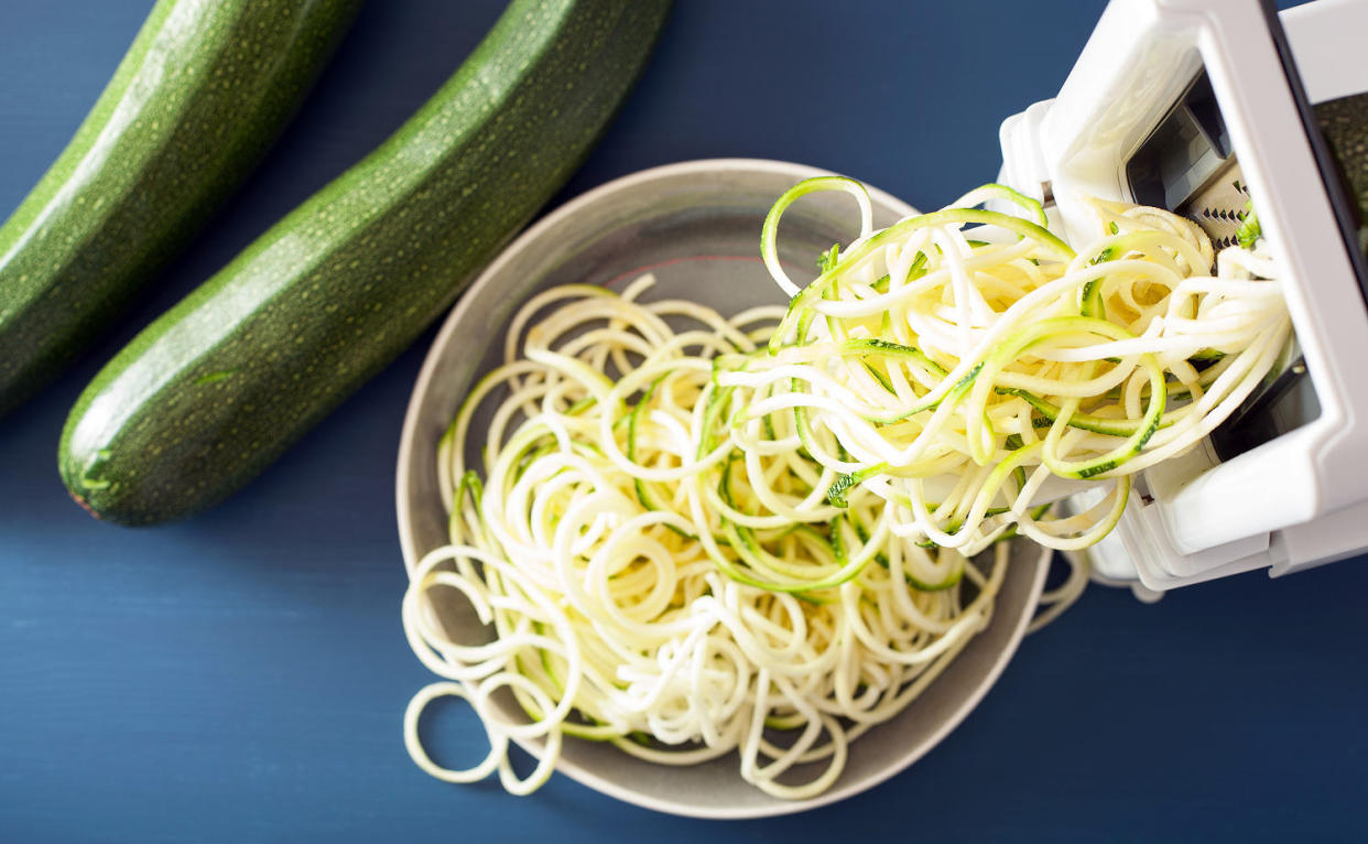 Making zucchini noodles with a spiralizer. (Olga Miltsova / Getty Images)