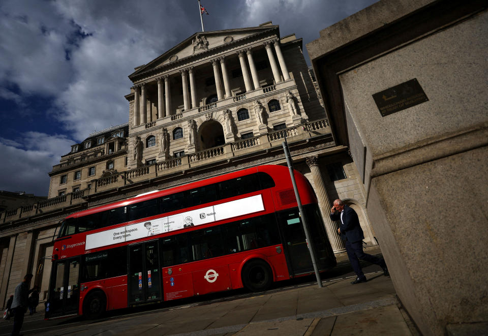 interest rates FILE PHOTO: A man walks past the Bank of England in London, Britain, September 28, 2022. REUTERS/Hannah McKay/File Photo