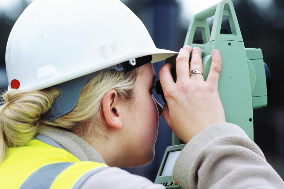 Woman engineer surveying, Angelsey waste water treatment upgrading works, Wales, UK. (Photo by Adrian Greeman/Construction Photography/Avalon/Getty Images)