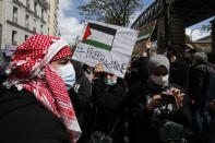 Protesters gather during a banned protest in support of Palestinians in the Gaza Strip, Saturday, May, 15, 2021 in Paris. Marches in support of Palestinians in the Gaza Strip were being held Saturday in a dozen French cities, but the focus was on Paris, where riot police got ready as organizers said they would defy a ban on the protest. (AP Photo/Michel Euler)